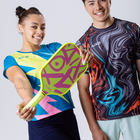 Players holding AIXO Ghost Neotag pickleball paddles — bright, bold, and full of attitude.